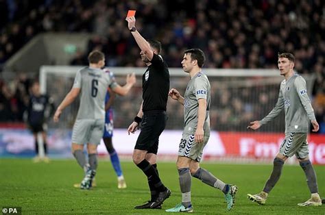 Fans and pundits slam 'DISGRACEFUL' red card shown to .